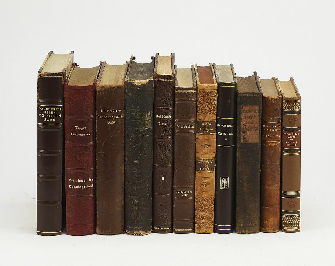 (11) 19th and 20th c. books with decorative spines: Group of (11) 19th and 20th century books, each having a decorative spine, in a variety of languages on various topics, smallest measuring 7.5"h x 5.5"w, largest measuring 8.75"h x 6"w.