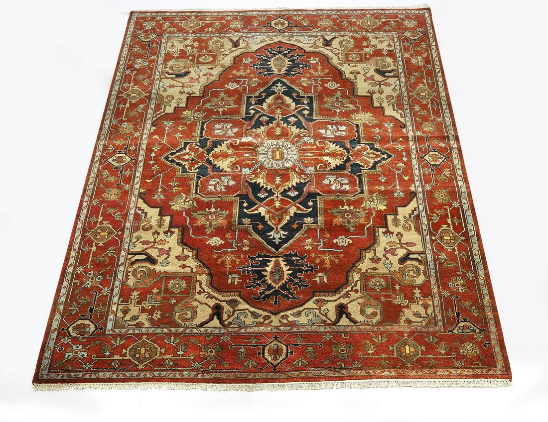 Hand knotted wool Indo-Serapi carpet, 11 x 9: Hand knotted wool Indo-Serapi carpet, having a medallion with pendants design in light blue, celadon, tan, cream, and black on a rust field with stylized vines, having a Herati border on a rust ground