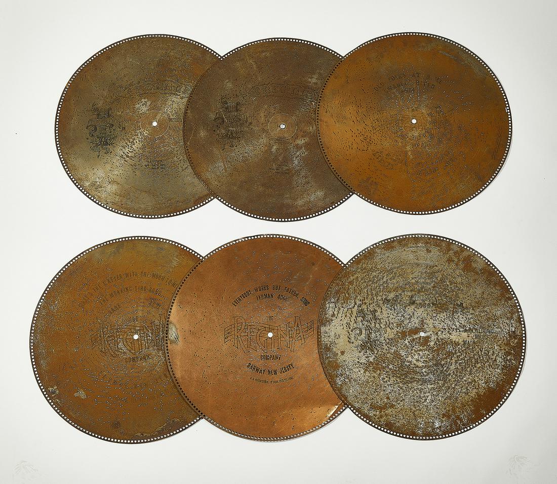 (6) Regina 27" music discs for an upright music box: (6) Regina 27"dia. steel music discs for an upright music box, comprising; the Wedding March, Everybody Works But Father, What's the Matter With the Moon Tonight, Old Folks At Home: Swanee River, and 