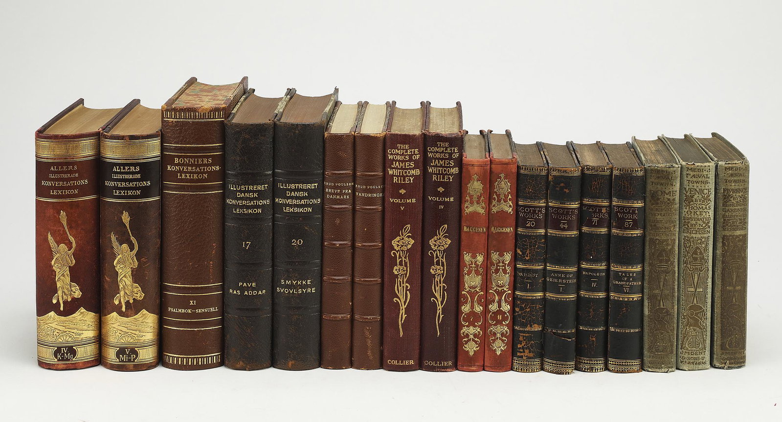 (18) 19th and 20th c. books with decorative spines: Group of (18) 19th and 20th century books, each having a decorative spine, in a variety of languages on various topics, smallest measuring 6.5"h x 4.25"w, largest measuring 8.5"h x 6"w.