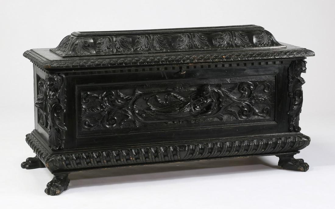 18th c. Italian carved walnut cassone, 52"l: Italian Renaissance Revival walnut cassone, 18th century, the hinged mansard top carved with acanthus leaves and egg and dart borders, the body ornately carved with acanthus leaf decoration, the front