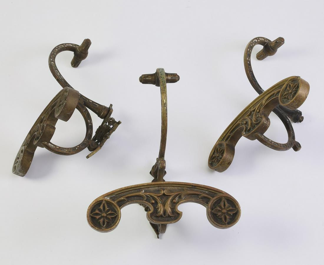(3) 19th c. decorative bronze wall hooks, 9.25"h: Group of (3) decorative bronze wall hooks, late 19th or early 20th century, each having acanthus and rosette decoration, 9.25"h x 8"w x 5.25"d.