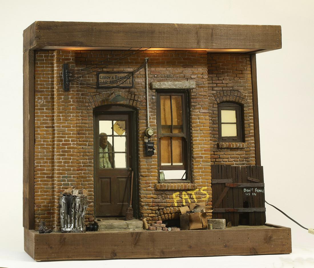 Signed Michael Garman diorama sculpture, 1975: Signed Michael Garman (American, b. 1938) mixed media dimensional diorama sculpture, 1975, depicting the facade of 'Leroy and Bertha’s Bar and Grill', with Leroy keeping watch from inside the front 