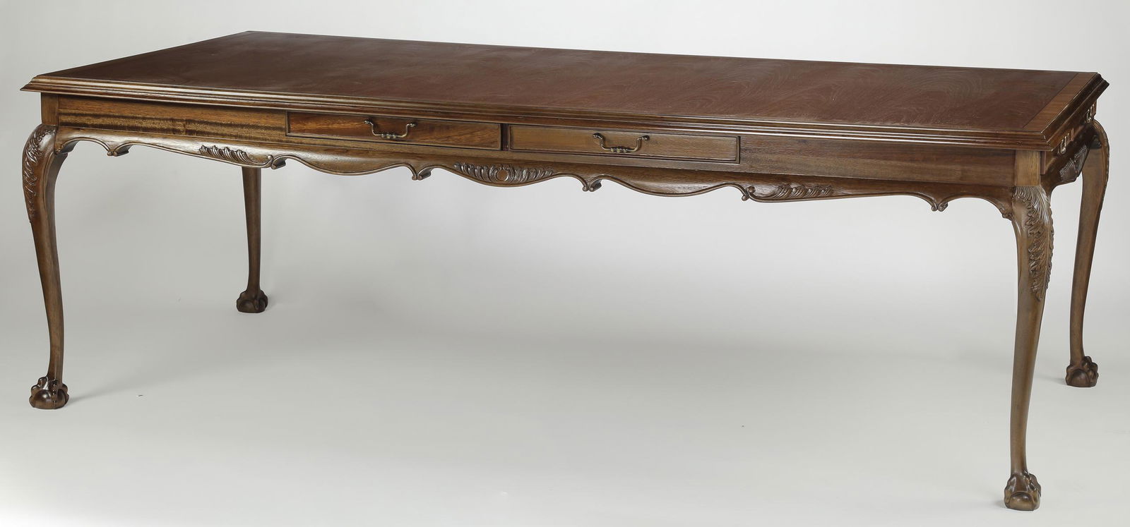 Chippendale style mahogany executive desk, 95"w: Chippendale style mahogany executive desk or conference table, having a rectangular top, above a wide apron with a scalloped edge and two drawers on each side, plus one drawer on each end, the whole r