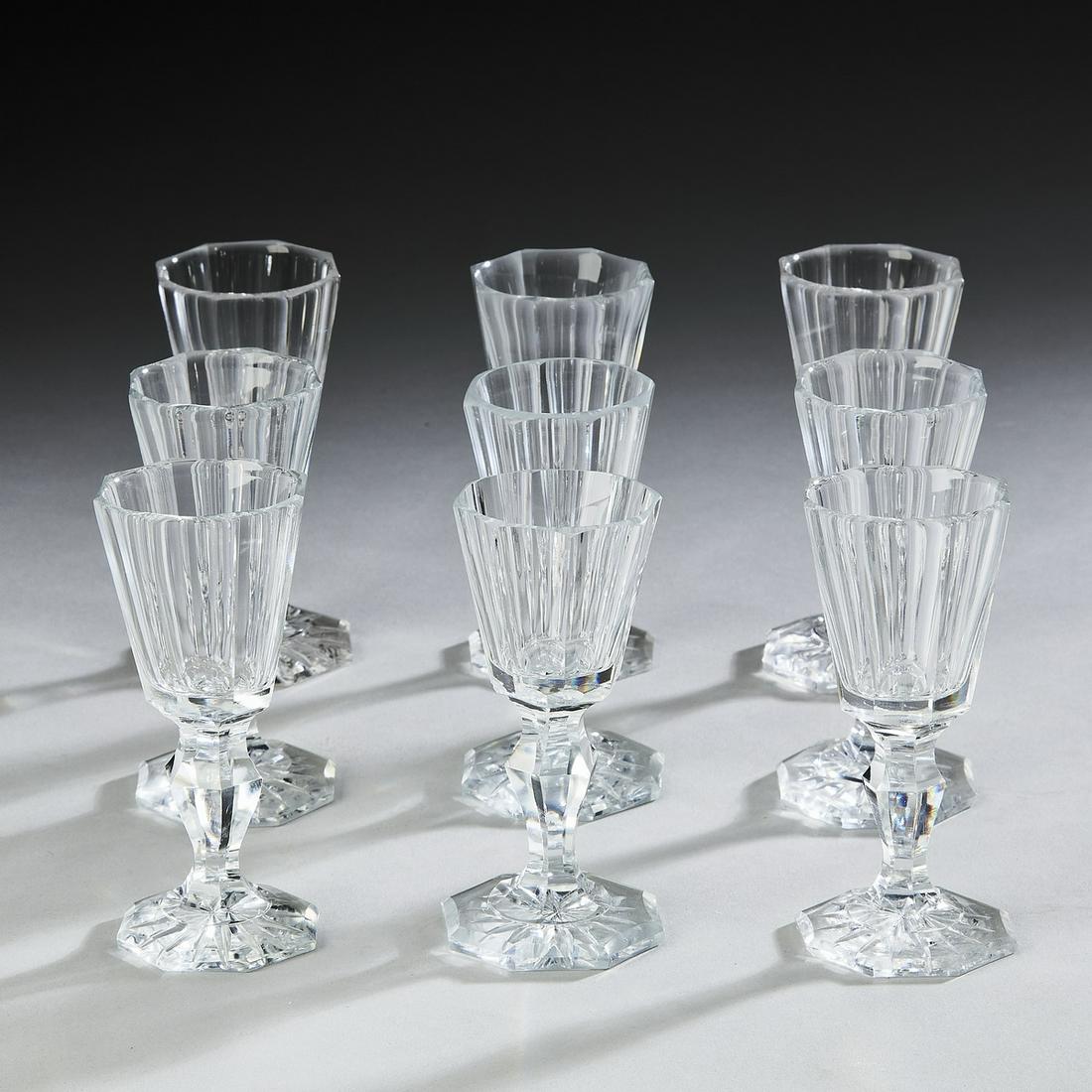 (9) Fluted crystal dram glasses, 3.75"h: (9) Cut crystal dram glasses, each having a funnel shaped bowl with eight fluted sides over a conforming baluster stem, terminating to eight sided foot with starburst, having no apparent mark, 3.75"h 