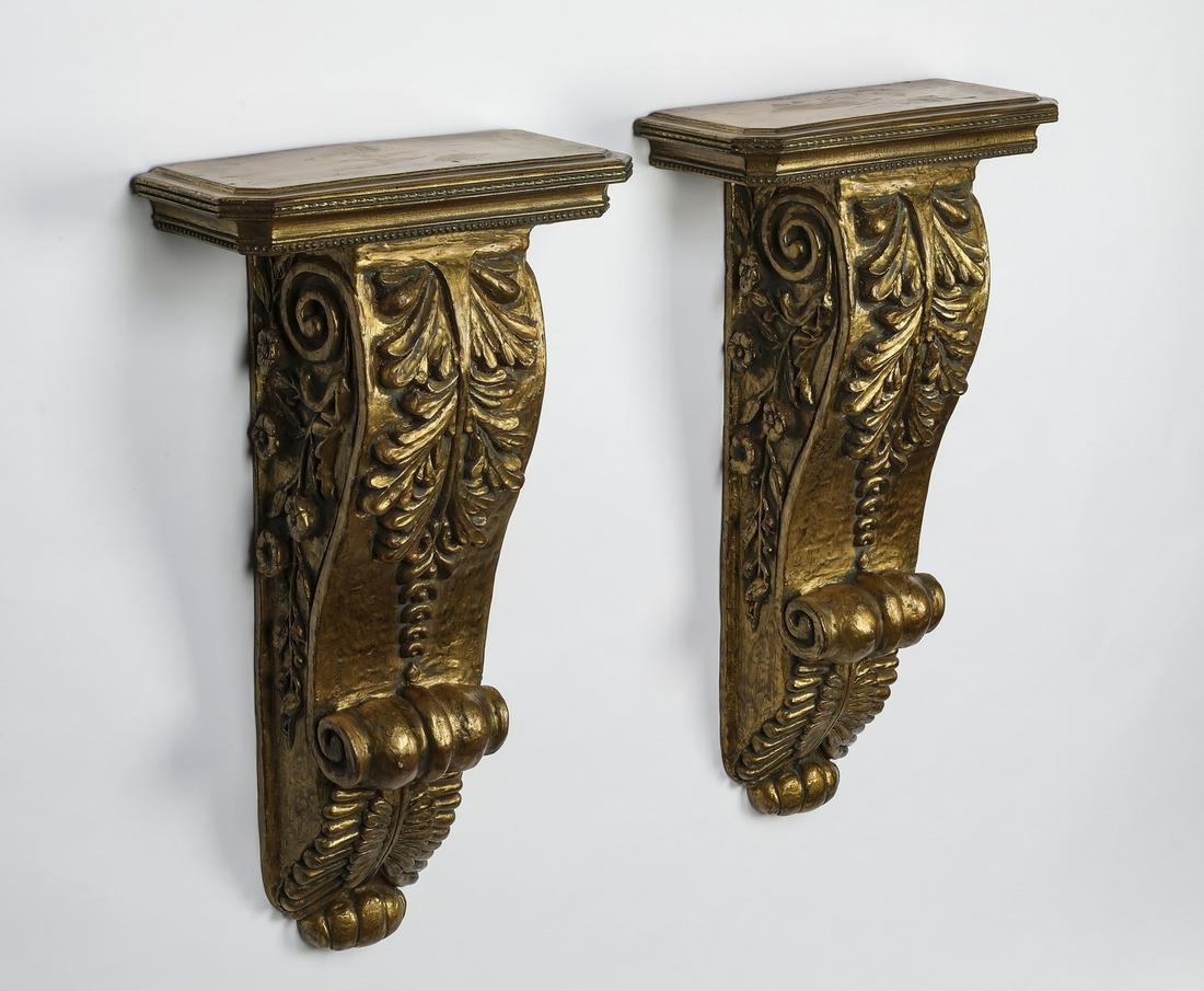Pair of gilt brackets with foliate designs, 30"h: Pair of gilt composition brackets with foliate designs, 30"h x 16.5"w x 8"d.