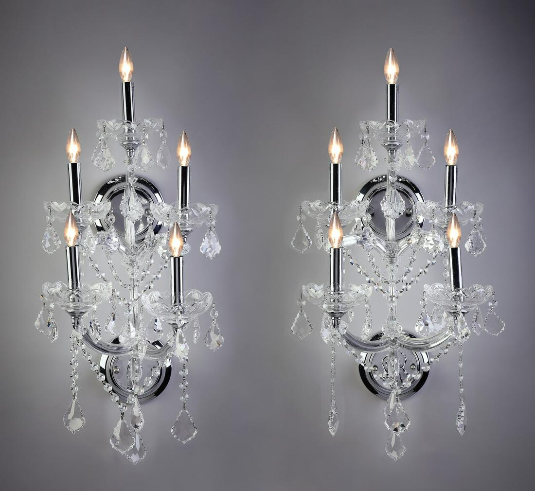 (2) Contemporary five-light crystal sconces, 26"h: Pair of contemporary 5-light crystal sconces, each having curving arms ending in crystal bobeches and silver toned candles, strung throughout with clear crystal beads and drops terminating to a facete