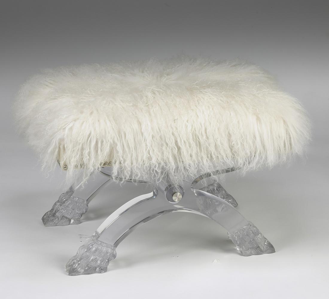 Hollywood Regency style white fur and acrylic seat: Mongolian fur and acrylic seat, in the Hollywood Regency taste, having a white fur surface rising on X-form legs terminating in hairy paw feet, maker marked to underside, 17"h x 25"w x 18"d.