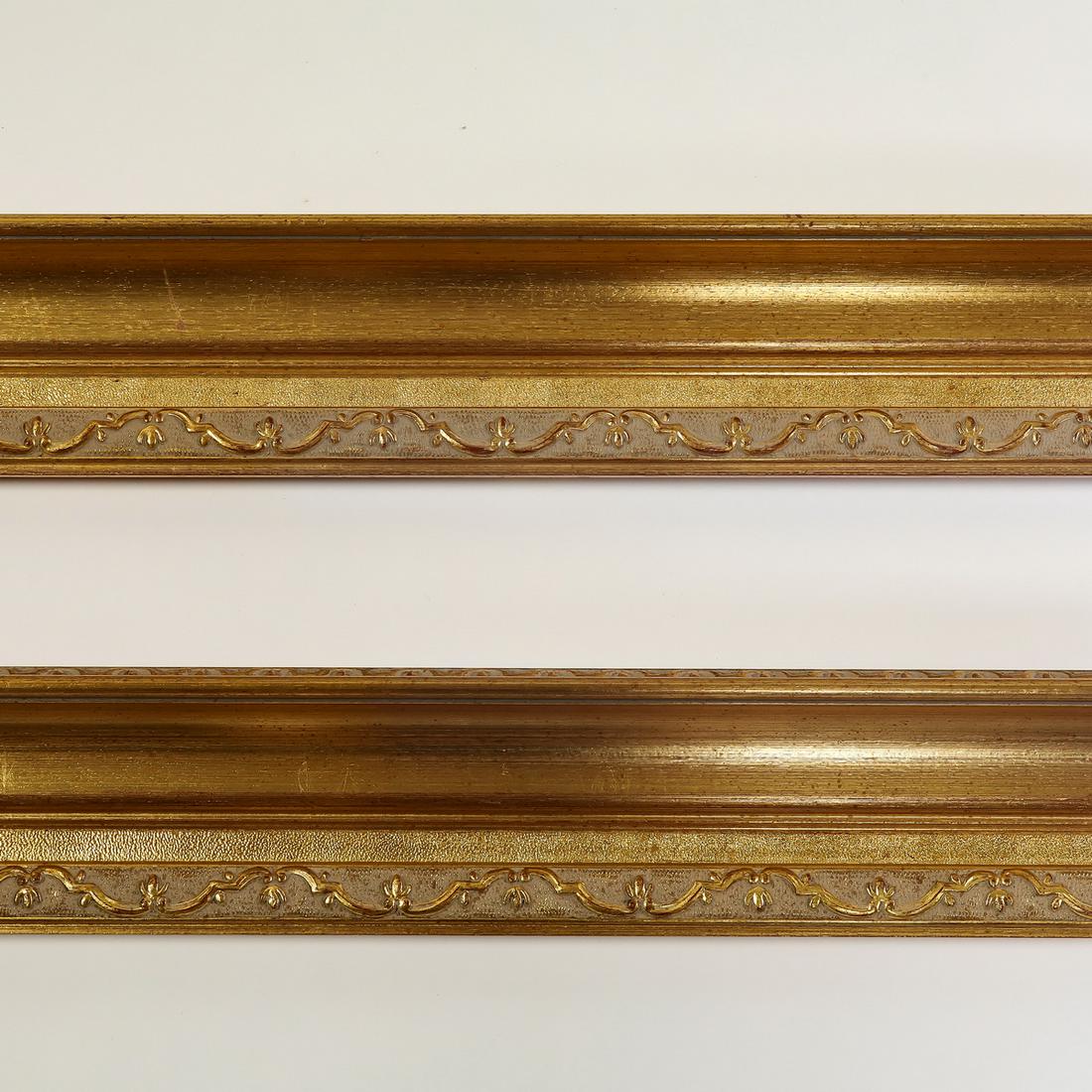 (2) Italian carved and gilt decorative moldings, 118": Pair of Italian carved and gilt decorative moldings, having a rocaille border, each measuring 5"h x 118.5"l x 3"d.