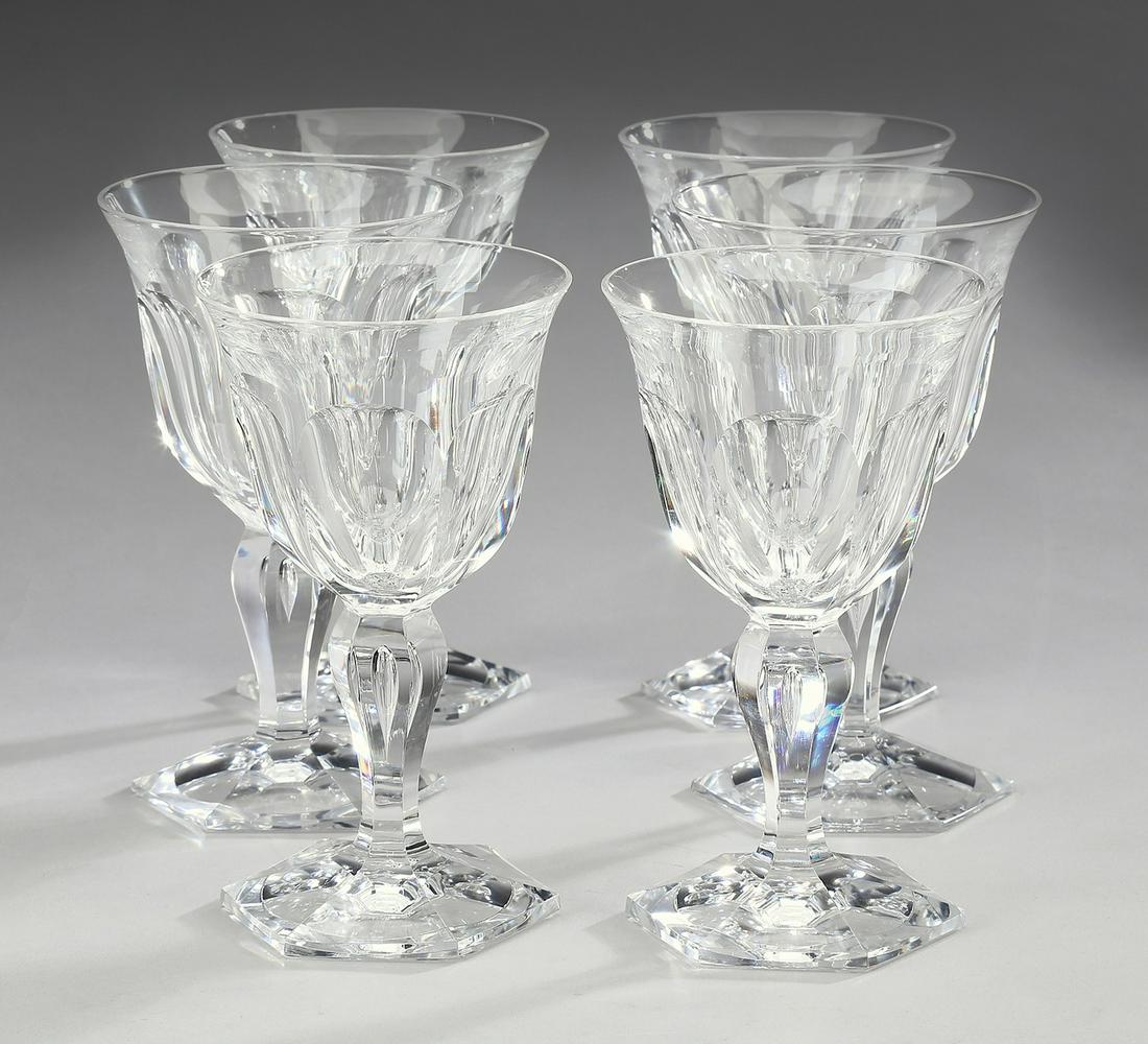 (6) Bohemian crystal wine glasses: Set of (6) Bohemian crystal wine glasses, each having a thumbprint bowl rising on a faceted baluster stem centering a bubble and terminating to a paneled foot, having no apparent marks, 5.75"h x 3.5"d