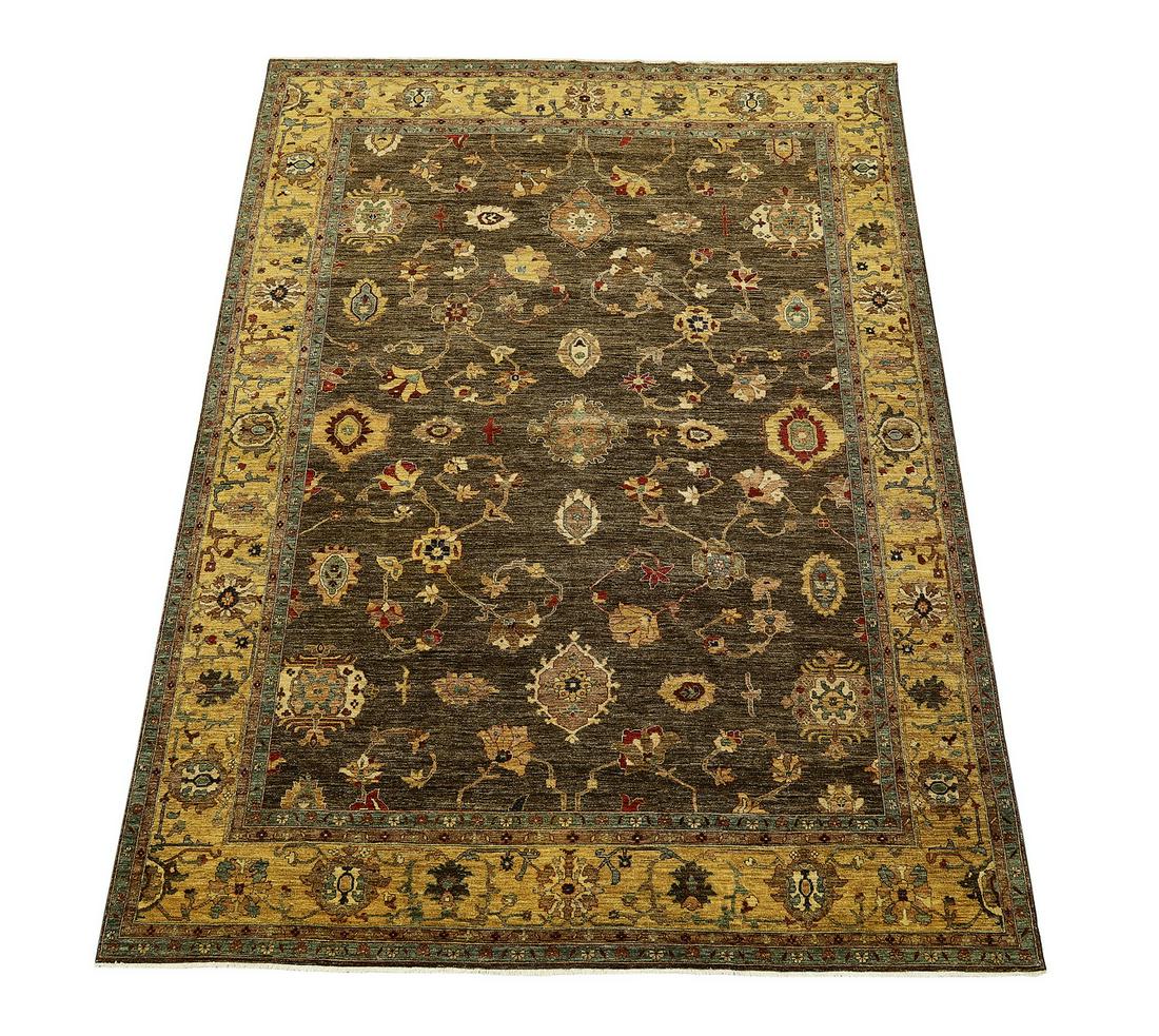 Hand knotted wool Pakistani Oushak, 13 x 10: Hand knotted wool Pakistani Oushak, having a full field of palmettes and stylized floral elements in cranberry, slate blue, cream, and gold on a chocolate ground, with an alternating palmette border o