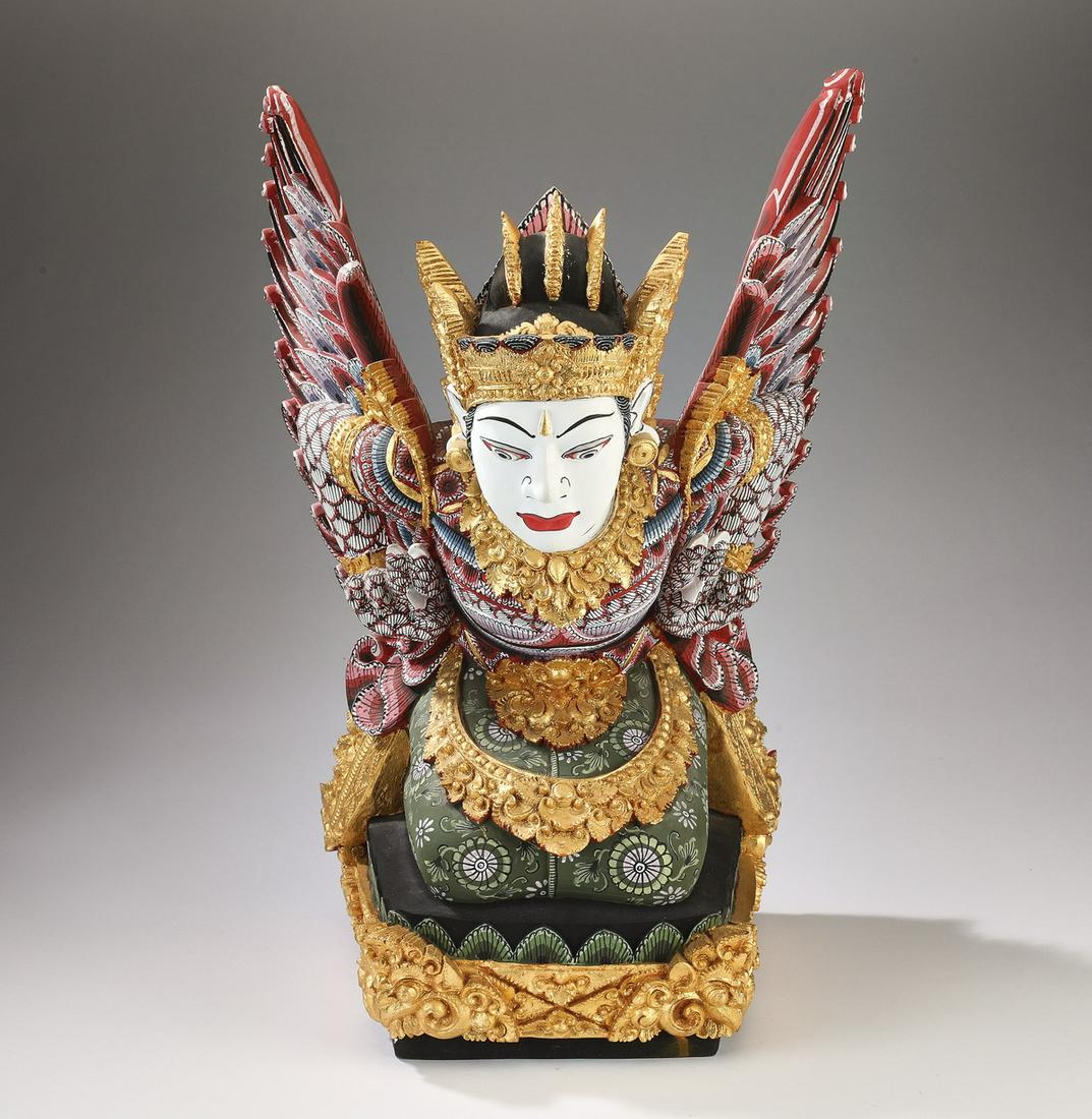Balinese gilt wood carving of the goddess Dewi Shi: Balinese gilt wood and paint decorated carving of the goddess Dewi Shi, the Earth Goddess and mother of the Javanese people, depicted kneeling with her wings extending backward, wearing a gilded headp