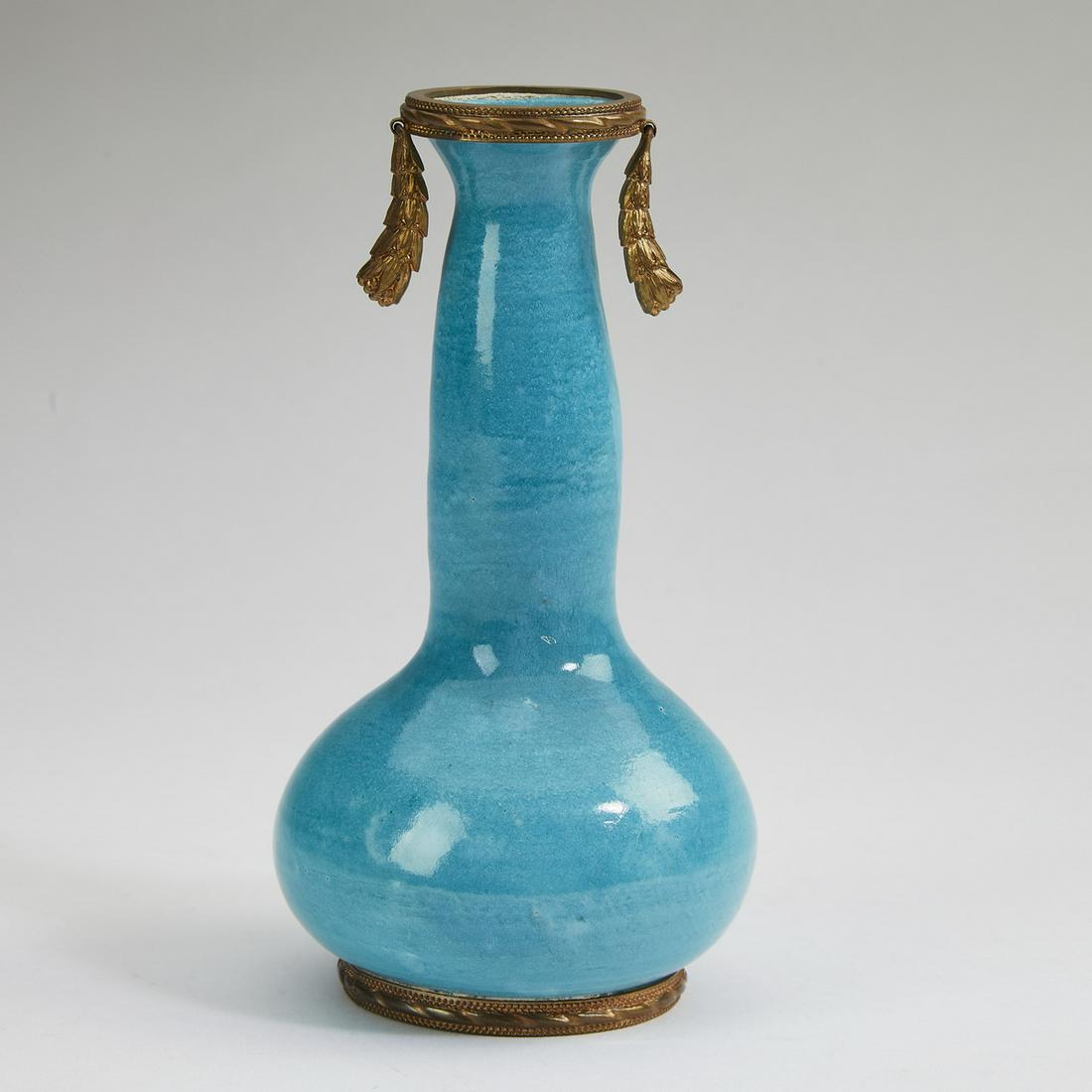 French bronze mounted faience vase, c. 1900: French bronze mounted faience vase, circa 1900, having double handles in the form of laurel wreaths flanking the bottle form terminating in a bronze mounted pedestal, marked 'France' to underside, 6"h