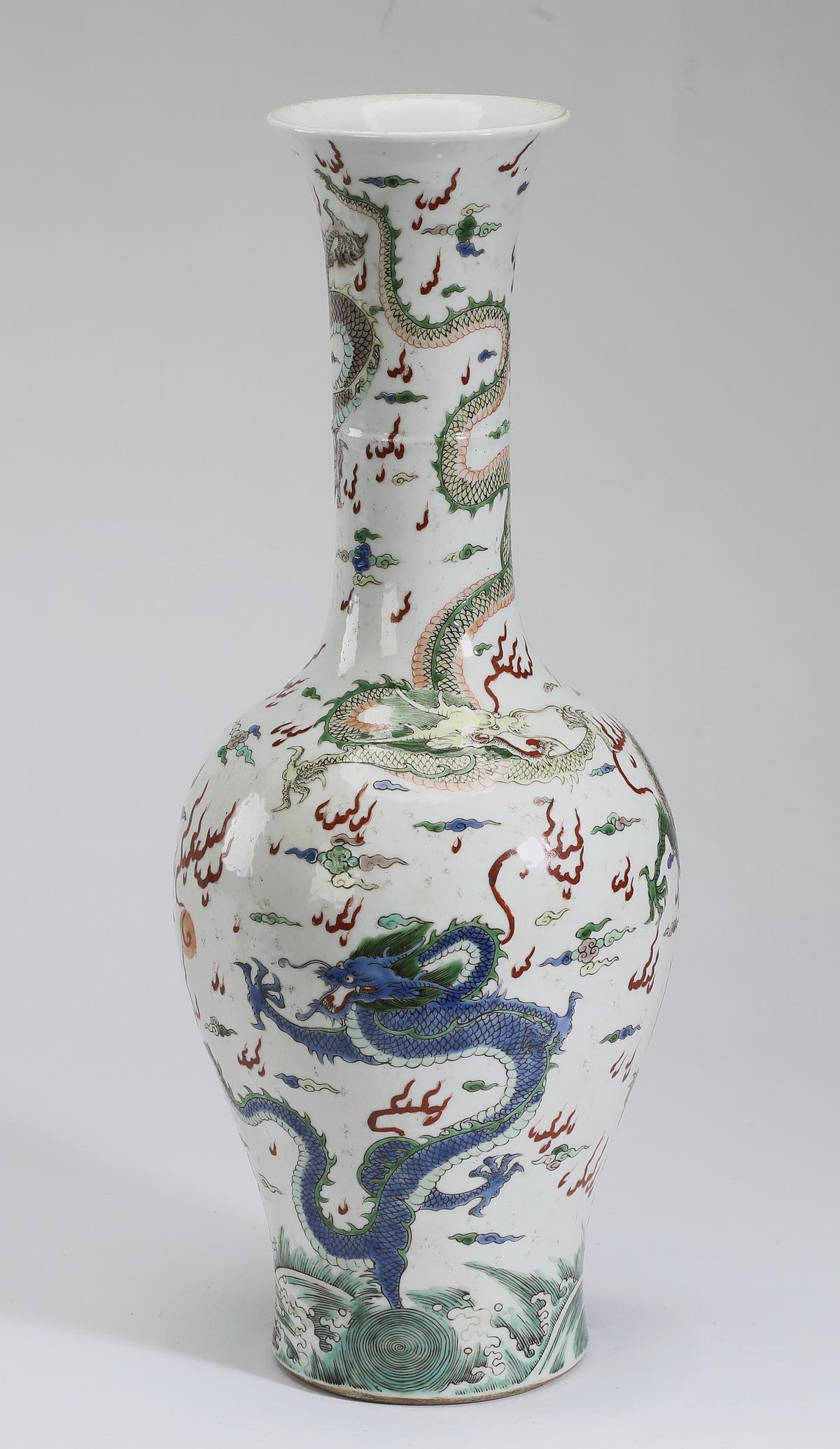 Chinese ducai dragon motif vase: Chinese ducai dragon vase, having a flared rim above a cylinder ringed neck, surmounting a tapering body, the whole decorated with writhing five clawed dragons contesting a pearl of wisdom amidst ausp