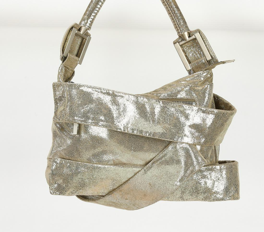 Authentic Limited Edition Fendi silver leather bag: Authentic Limited Edition Fendi silver nubuck leather bag, having a rolled strap, an exterior pocket, and silver-tone hardware, the zipped closure opening to the suede lined interior with a single poc