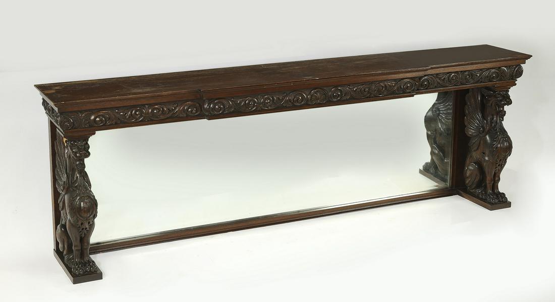 Late 19th c. carved oak overmantle mirror, 70"w: Carved oak overmantle mirror, late 19th century, having a molded cornice relief carved with acanthus scrollwork rising on gryphon figural supports, centering a beveled edge mirror, 24.5"h x 70.25"w x 