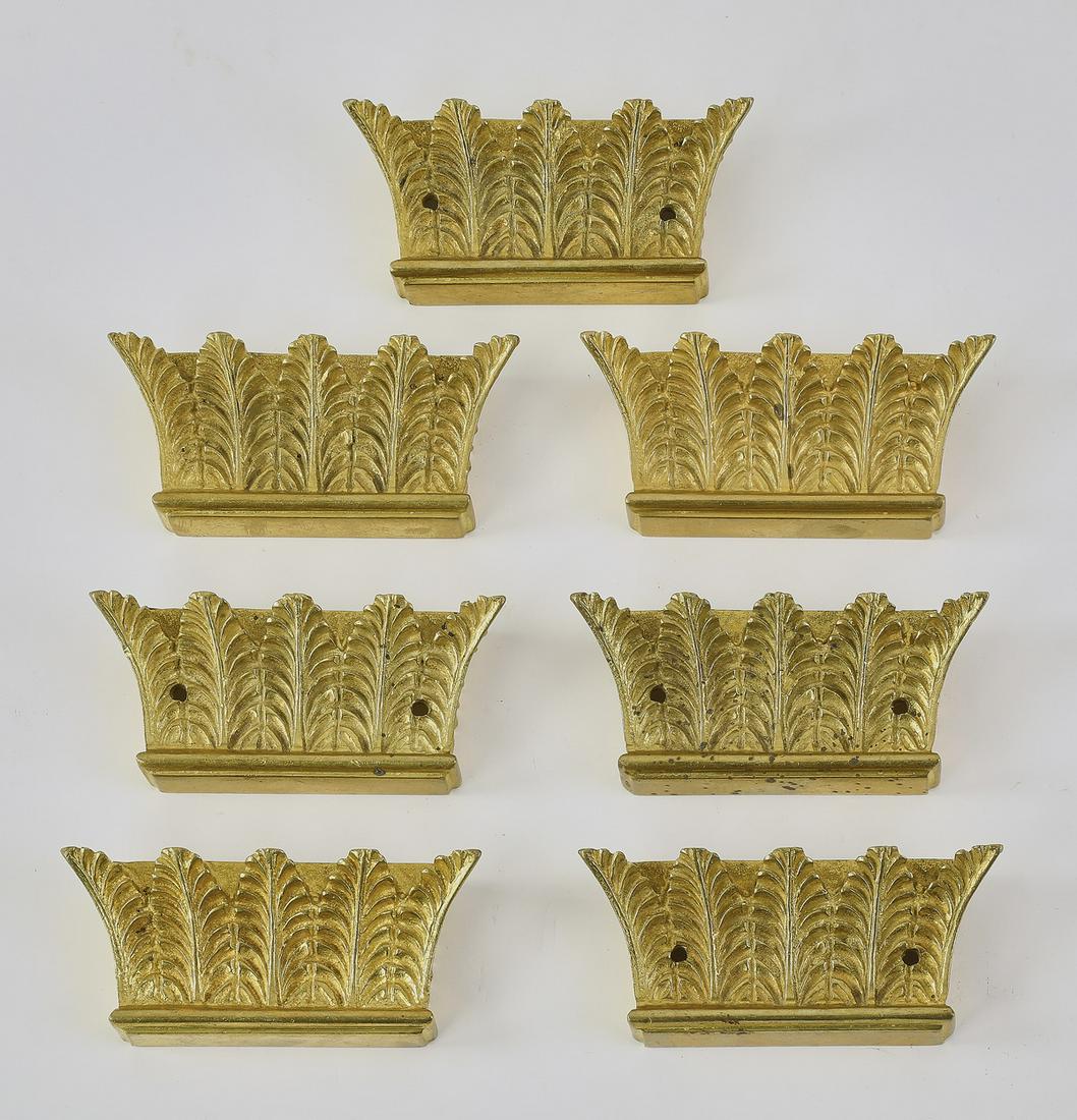 (7) Italian gilt metal acanthus capital appliques: Group of (7) Italian gilt metal appliques, each in the form of acanthus leaf capitals, 2"h x 5"w x 1"d.