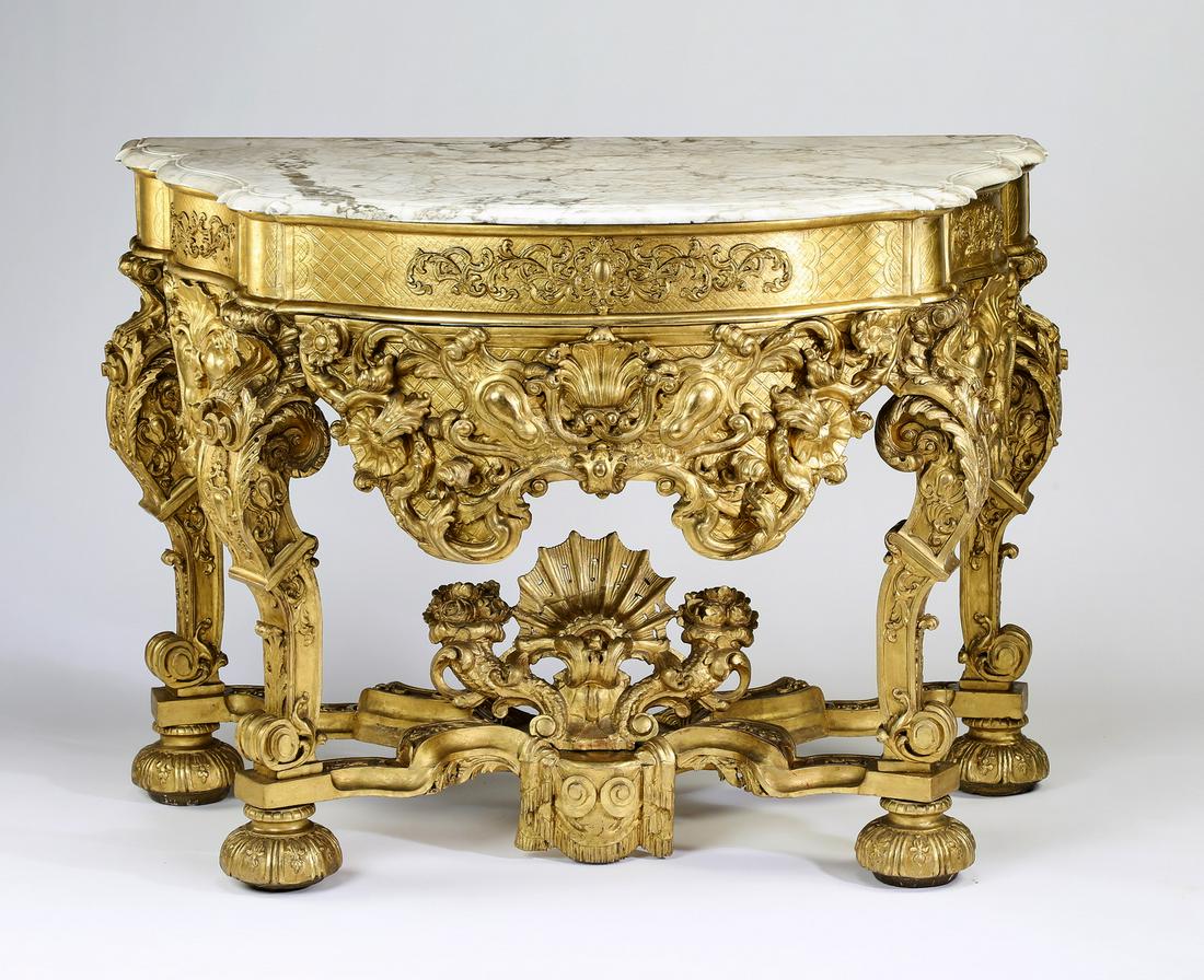 Italian Baroque style marble top console: Italian Baroque style marble top console, executed in gold paint decorated carved wood, having a shaped rectangular white marble top surmounting a patterned frieze, above a wide pierced apron of rocai