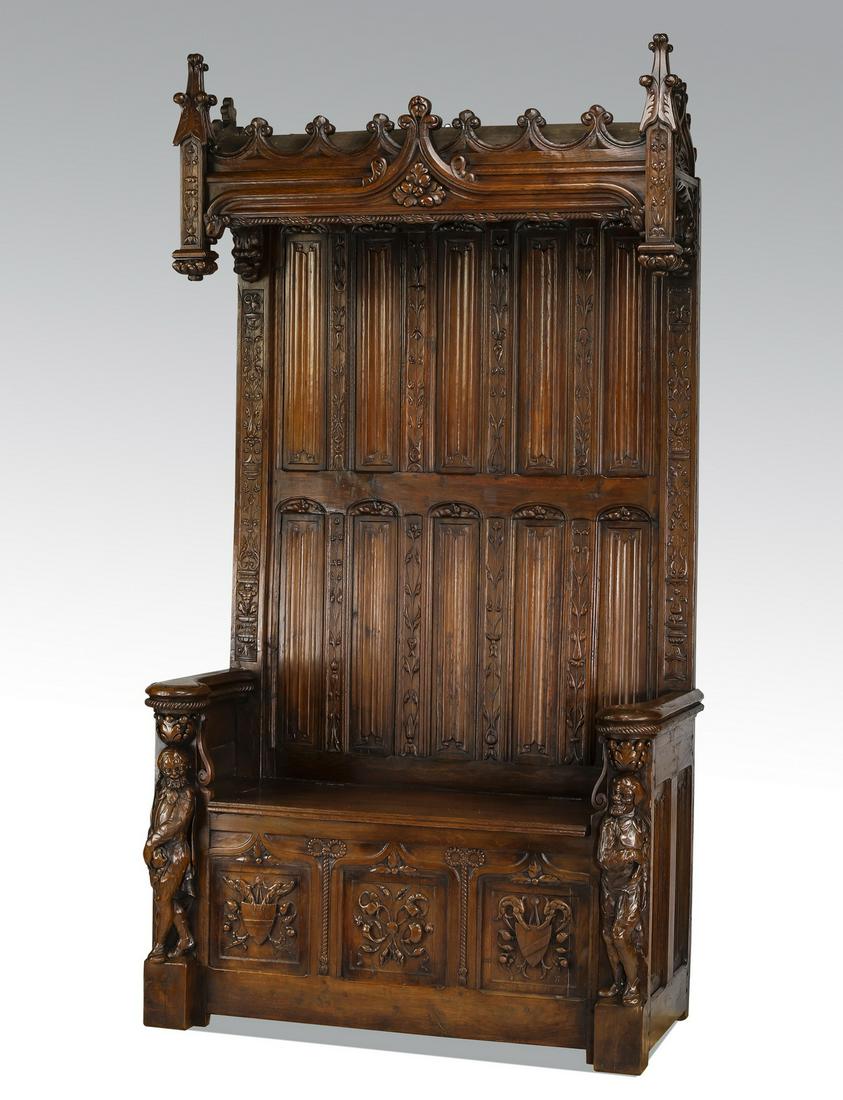 19th c. French Gothic Revival oak hall bench, 93"h: Gothic Revival French oak hall bench, in the form of a bishop's chair, early 19th century, having a carved canopy of fleur de lis over linen fold paneling, surmounting a hinged seat opening to storage