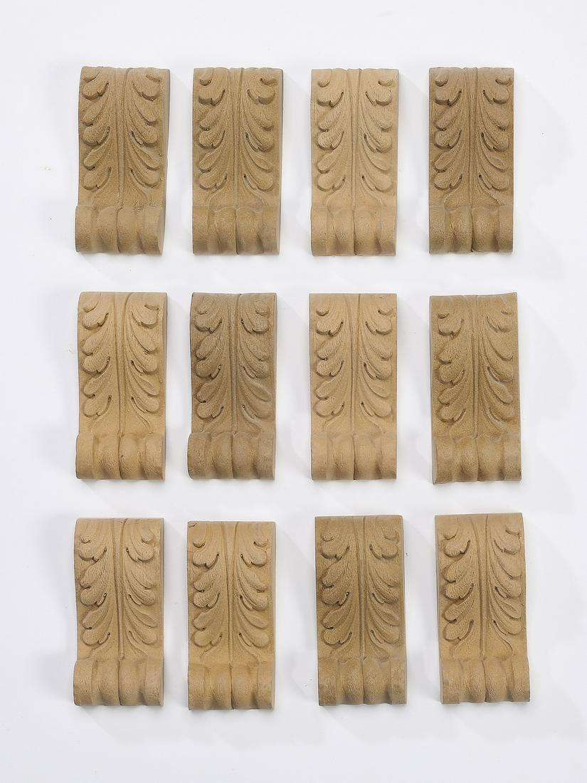 (12) Carved wood acanthus leaf appliques, 3.5"h: Group of (12) carved wood appliques, each of acanthus leaf form, ready for your stained or painted finish, 3.5"h x 1.5"w x 0.75"d.