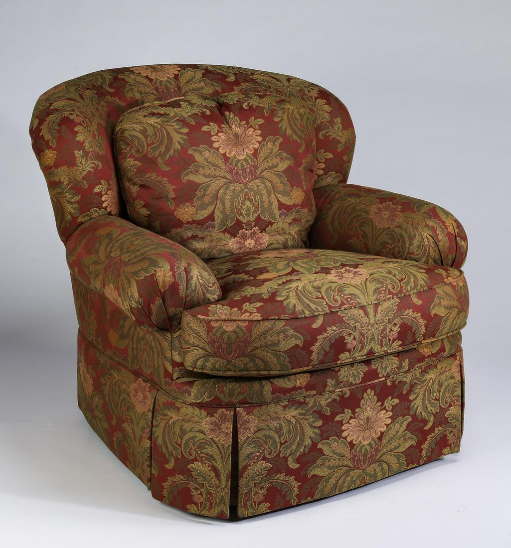 Wesley Hall upholstered curving armchair: Wesley Hall upholstered curving armchair, covered in polychrome jacquard, with curved front and pleated skirt, 36"h x 39"h x 44"d.