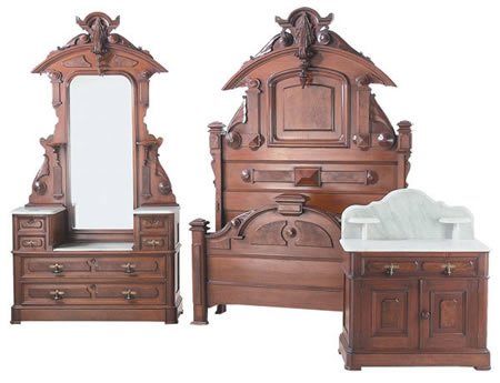 Attributed to Thomas Brooks bedroom set: Massive 19th century American three piece walnut bedroom set attributed to Thomas Brooks, includes highback bed with bowfront footboard (107"h x 65"w), step-up marble top mirrored dresser (110"h x 49"