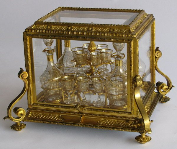 19th century tantalus set: 19th century Louis XV-style dore' bronze mounted tantalus set with four decanters and 16 cordial glasses in fitted holder, 13"h x 18"w x 15"d.