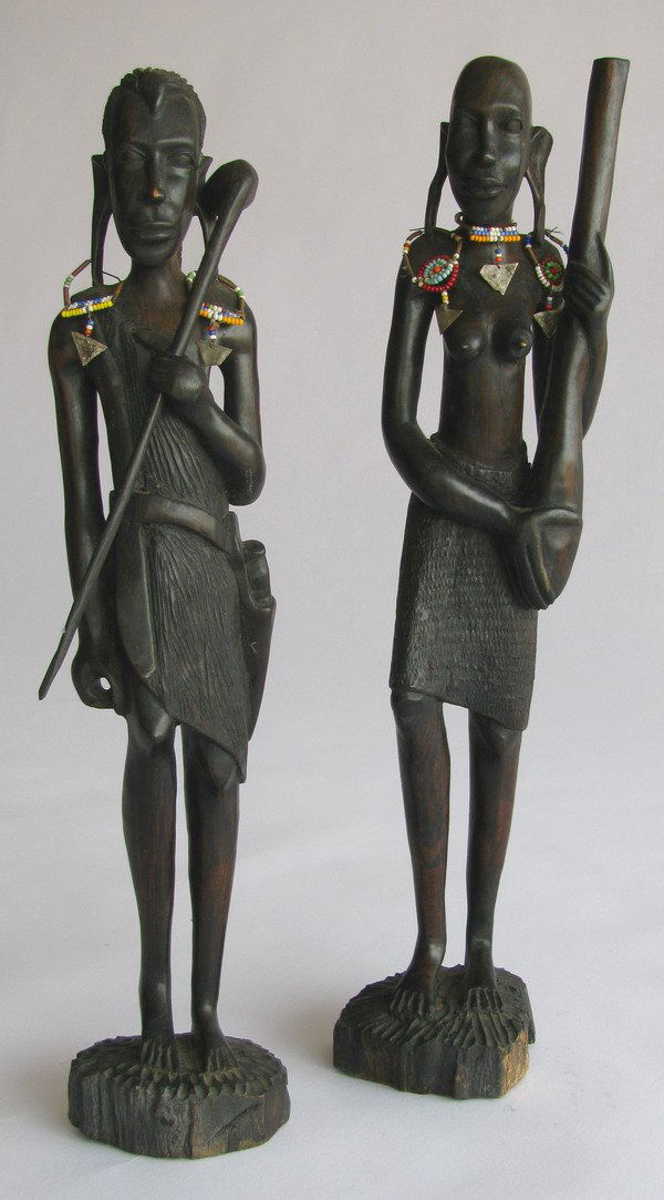 Pair of carved ebony Masai figures: Pair of male and female carved Masai tribal figures, 16"h.