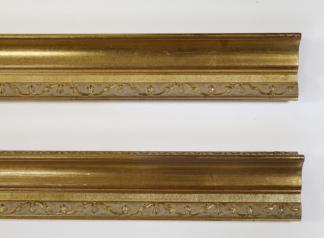 (2) Italian carved and gilt decorative moldings, 118": Pair of Italian carved and gilt decorative moldings, having a rocaille border, each measuring 5"h x 118.5"l x 3"d.