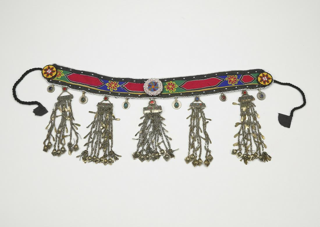 Uzbek hand worked suzani style dance belt: Uzbek dance belt, mid 20th century, executed in cotton, silk thread, chain stitch embroidery, glass beads, and white metal, having a band of chain stitch embroidery in green, purple, and red, dotted w