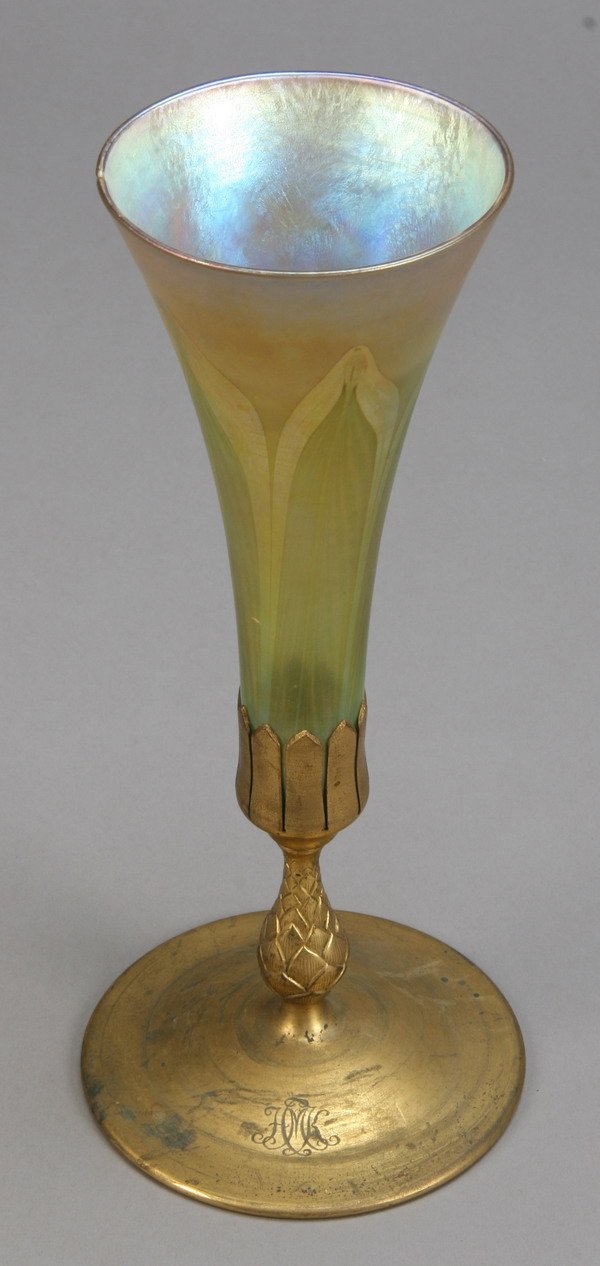 Tiffany trumpet vase: Tiffany gold iridescent feather design favrile glass trumpet vase, marked "L.C.T.", with dore' bronze base, marked "Tiffany Studios, New York 1043", 11.5" tall.