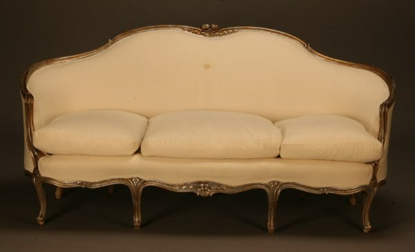 19th c. Louis XV-style settee: 19th century Louis XV-style carved and silver gilt settee, upholstered in muslin fabric, 36"h x 72"l x 34"d.