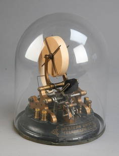 Authentic Western Union stock ticker: Authentic Western Union stock ticker, Edison Universal type 3A, Serial # 729, has a lacquered brass mechanism, and base with original black paint and gilt "Western Union Telegraph Co." cartouche shape