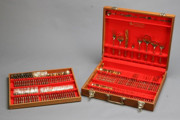 Set of bronze flatware gifted to former CIA Dir.: Set of bronze flatware, service for 12 with 10 serving pieces, in fitted teakwood case (missing one butter knife and two original serving pieces). Commemorative plaque on case reads: "Presented to Wil