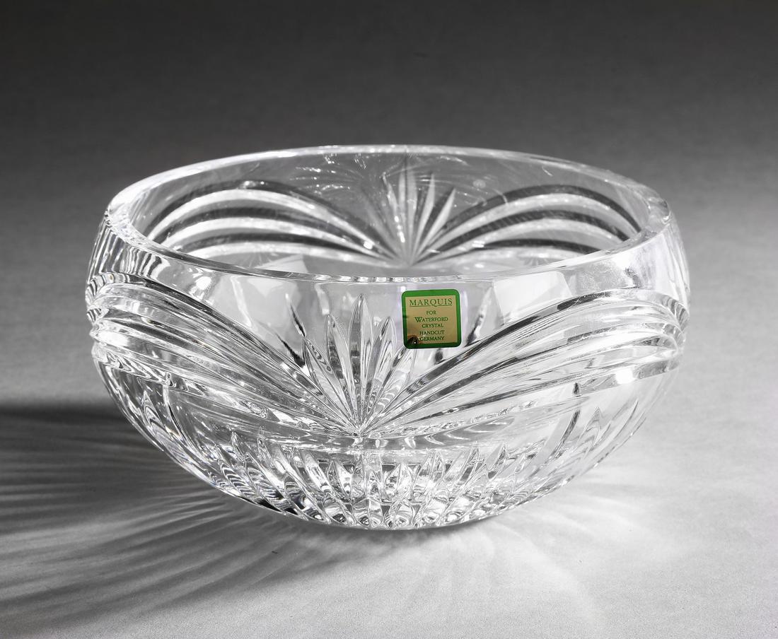 Marquis by Waterford center bowl: Marquis by Waterford center bowl, in a radiating and arch cut pattern, retaining original sticker, 3.75"h x 7.5"dia.