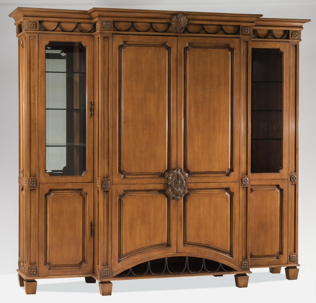 Phyllis Morris contemporary entertainment unit: Contemporary entertainment unit by Phyllis Morris, 20th century, having a molded cornice surmounting a band of alternating iron swags and carved rosettes with a central shell, above two over two doors