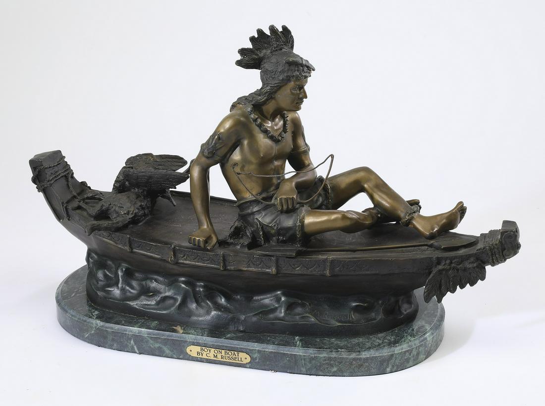After Charles Marion Russell, 'Boy on Boat' bronze: After Charles Marion Russell (American, 1864-1926) 'Boy on Boat,' executed in bronze, depicting a bare-chested Native American boy seated on a canoe with his kill, rising on a green marble plinth, sig