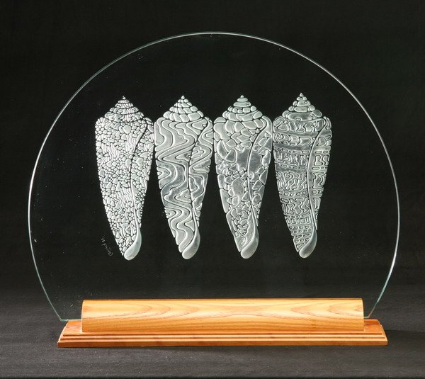 Art glass etched disc with stand: Art glass disc in wood stand etched with standing seashells, 20"h x 24"w.