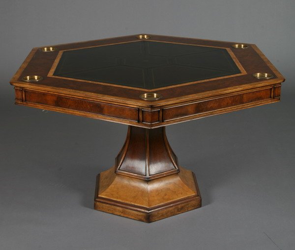 Game table with tooled leather top: 20th century octagon shaped game table with inset tooled leather top and brass drink coasters, on a pedestal base, 32"h x 52" diam.