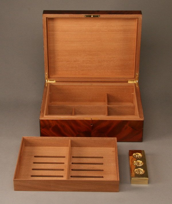 Italian mahogany humidor: Italian bookmatched mahogany humidor with two tier compartmentalized interior, 6"h x 16"w x 12"d.