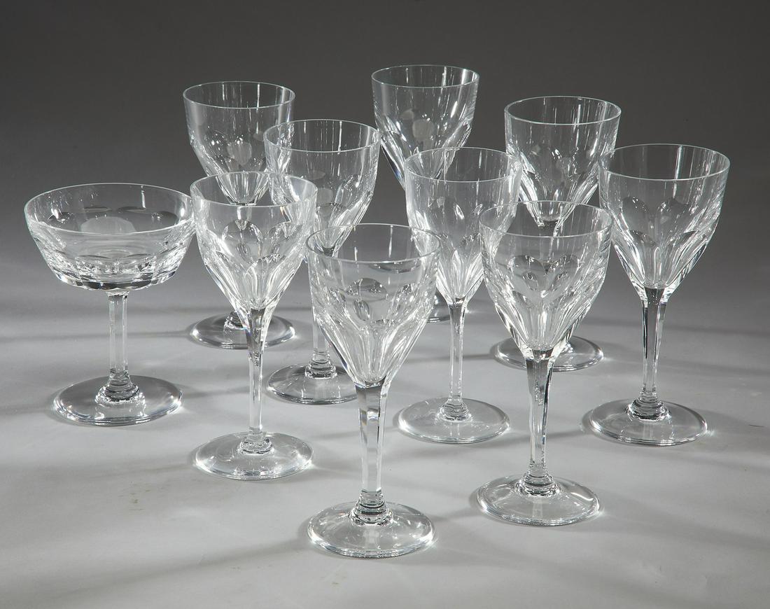 (10) St. Louis Crystal stem glasses, Bristol pattern: (10) St. Louis Crystal stem glasses, executed in clear crystal in the Bristol pattern, comprising (9) wine glasses each having an angular funnel shaped bowl with six inverted tear drop facets at the w
