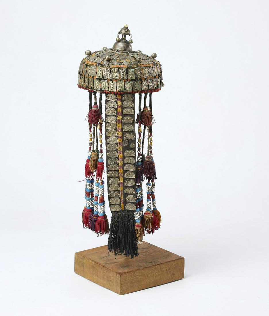 Ersari silk, cotton, and silver woman's cap: Woman's cap (Tjubetejka) with a finial (Gupba), Ersari peoples, Uzbekistan early 20th century, executed in silk, cotton, nickel silver, glass, and carnelian, of slightly domed form with a nickel silve