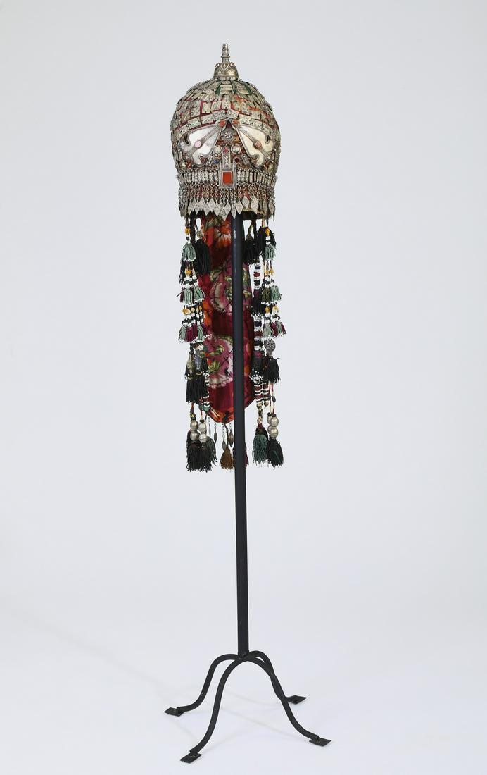 Woman's mixed media cap (Tjubetejka) with stand: Woman's cap (Tjubetejka) with headband ornament (Sinsile) and domed finial (Gupba), Uzbekistan or Turkestan, early 20th century, executed in silk, cotton, nickel silver, glass, and carnelian, of domed
