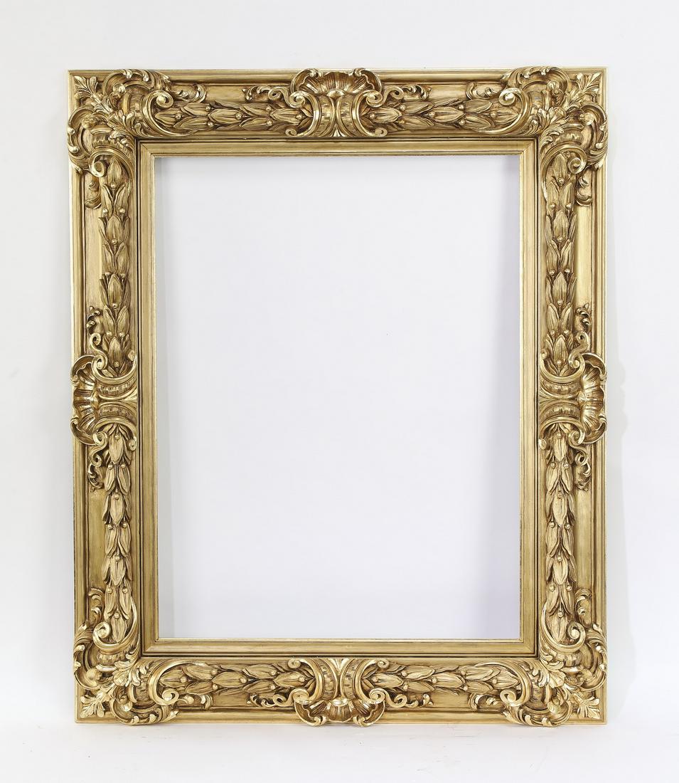 Impressive hand carved Italian giltwood frame: Impressive hand carved Italian giltwood frame, having highly figured acanthus cartouches and laurel garland borders, outside dimensions 54.5"h x 44.25"w x 3"d, inside dimensions 39.5"h x 29.75"w.