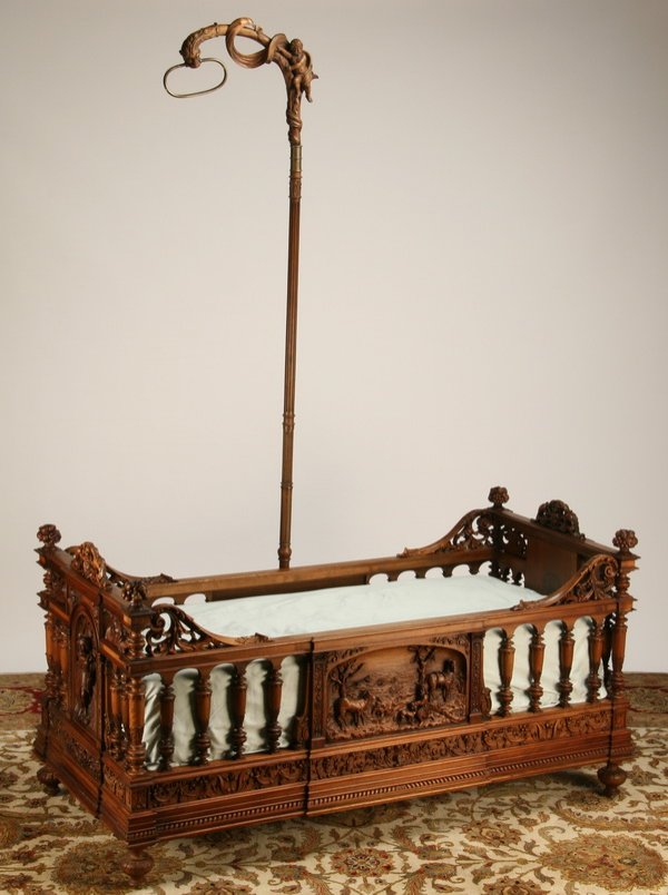 19th c. carved walnut child's bed by Luigi Frullini: 19th century Italian Renaissance Revival carved walnut child's bed by famed Italian master carver Luigi Frullini, features intricately relief carved panels on each side depicting Renaissance period sc