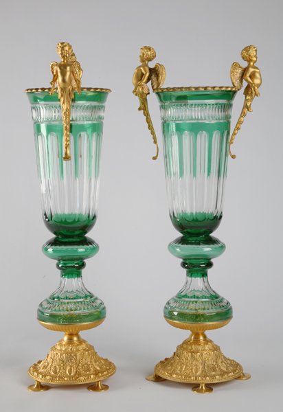 Pair of emerald crystal and bronze vases: Pair of emerald cut crystal pedestal vases with dorè bronze cherub handles and footed base, 32"h.