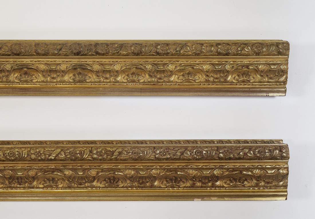 (2) Italian carved and gilt decorative moldings 119"l: Pair of Italian carved and gilt decorative moldings, having floral, scallop, and ribbon borders, each measuring 5"h x 118.5"l x 2.5"d.