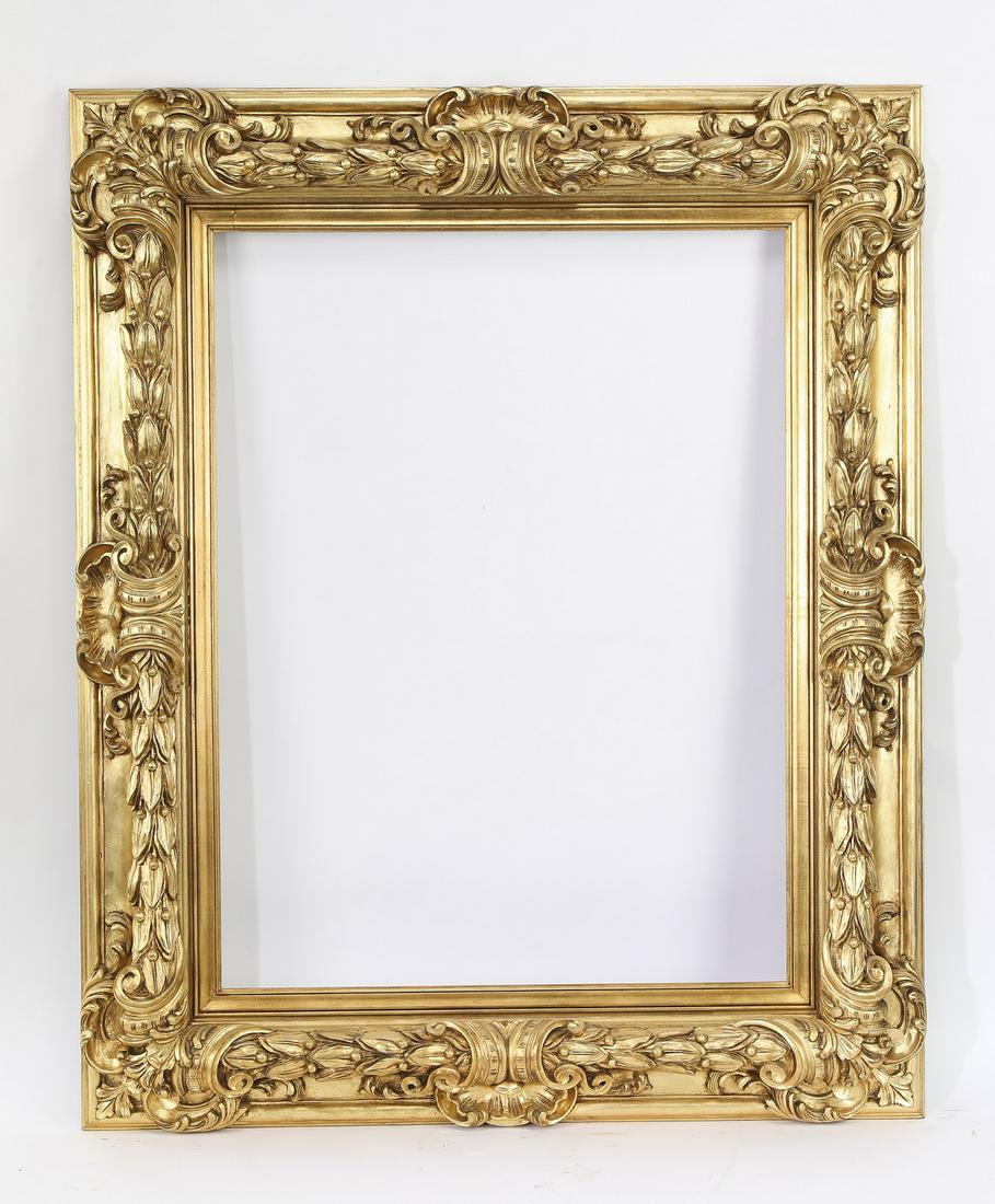 Impressive hand carved Italian giltwood frame: Impressive hand carved Italian giltwood frame, having highly figured acanthus cartouches and laurel garland borders, outside dimensions 54.5"h x 44.25"w x 3"d, inside dimensions 39.5"h x 29.75"w.