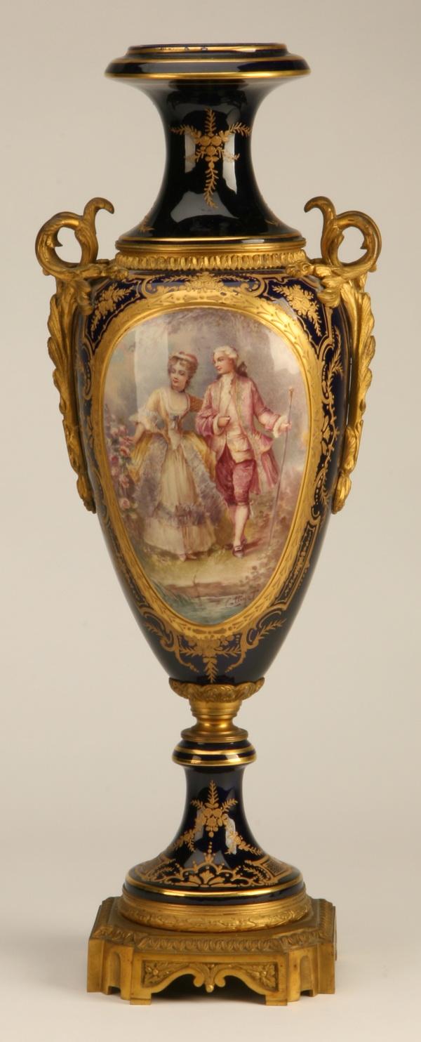 19th c. continental porcelain vase: Late 19th century continental porcelain vase with dore' bronze mounts on a cobalt blue ground decorated with pastoral scenes, artist signed Cottizet, 24"h.
