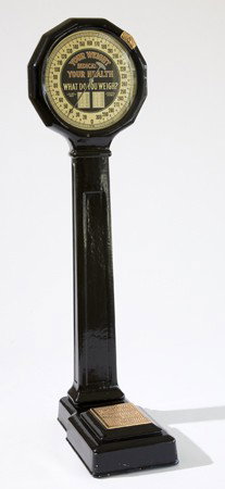 American coin-op Lollipop arcade scale: American coin operated "Lollipop" arcade scale manufactured by the National Automatic Machines Company, St. Paul, Minnesota. Scale has original black porcelain case with brass accents and original fac